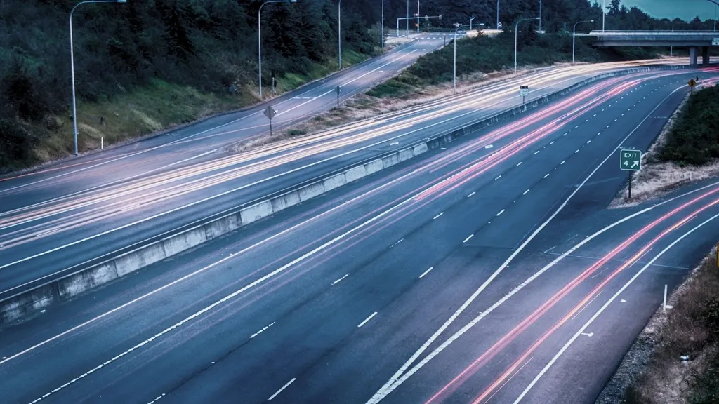 Motorway at night in long exposure, headlight trails
