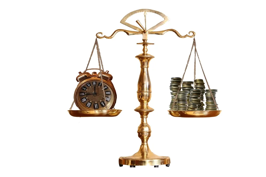 Golden balance with an alarm clock on one pan and coins on the other