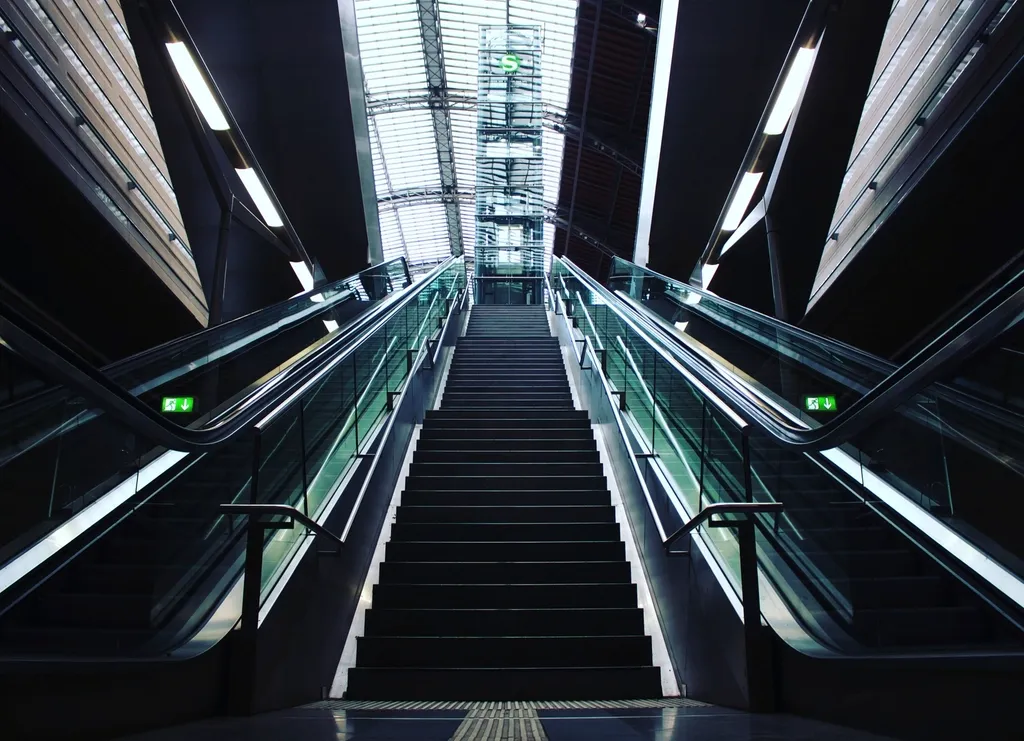 Escalators in a station, symmetrical framing
