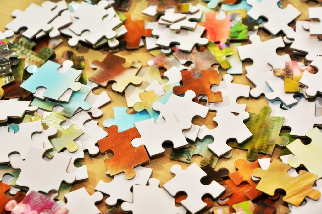 Colourful puzzle pieces jumbled together