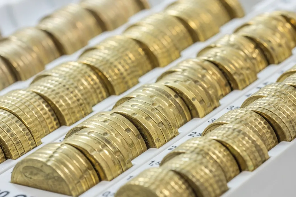 Rows of coins lined up in rolls