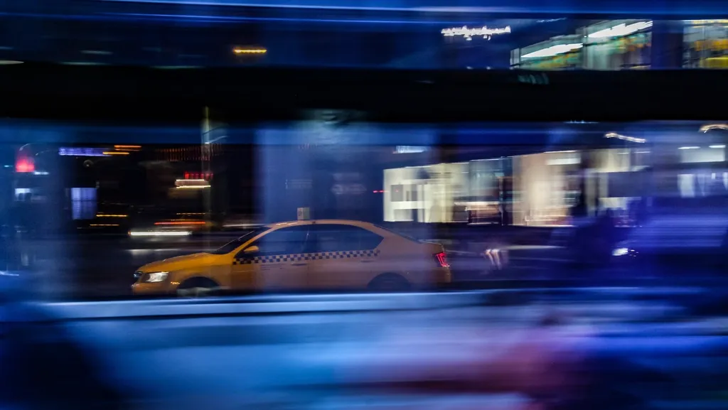 Taxi in motion blur on a city street